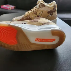 Jordan Tan and Orange Athletic Shoes with Camouflage Design