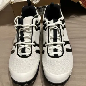 Wilson White and Black Tennis Athletic Shoes with Modern Design
